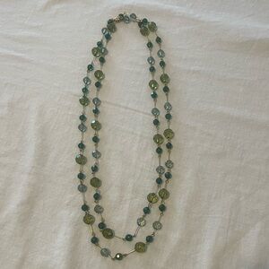 Joan Rivers long, green bead necklace